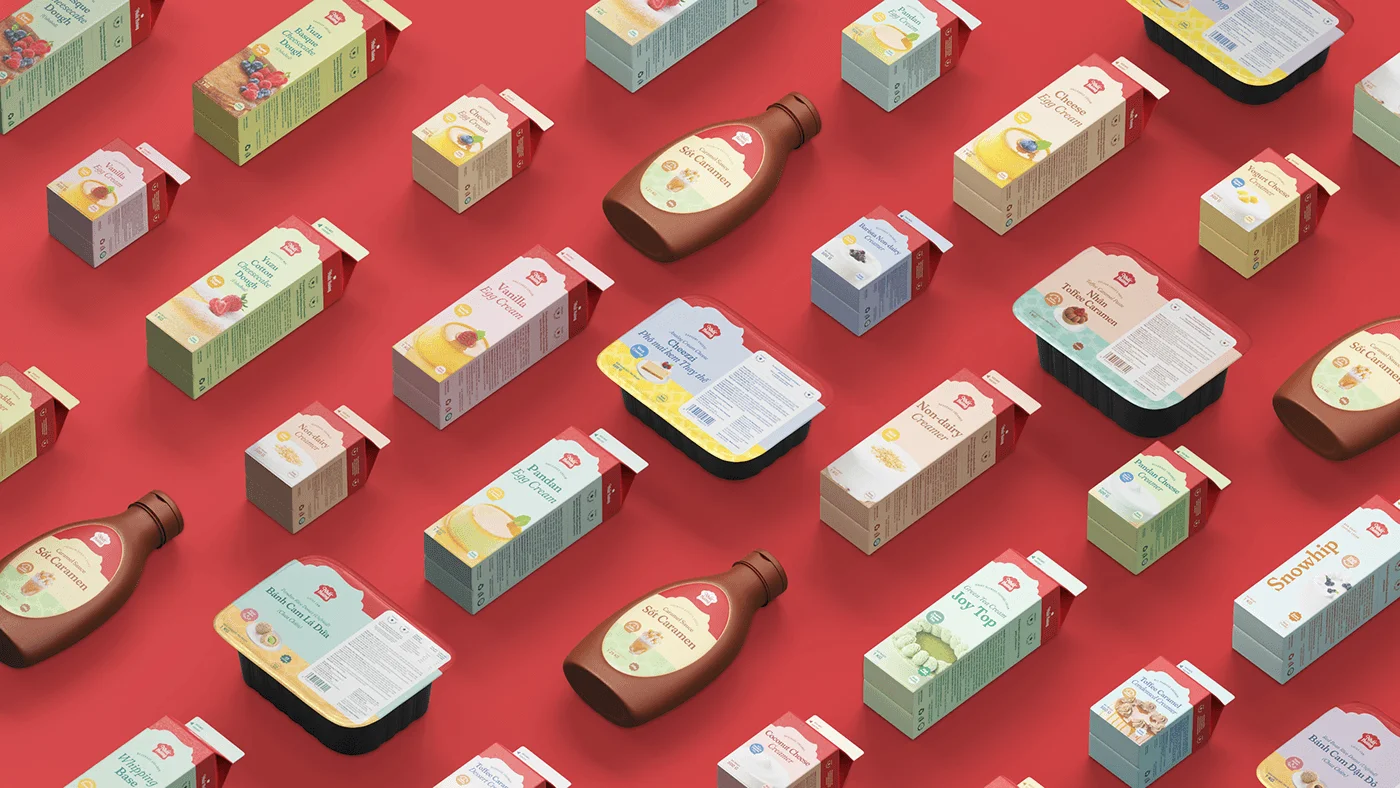 The refreshed Nhat Huong packaging system: cartons, tubs, and sauce bottles arranged diagonally on the brand's sweet-red ground
